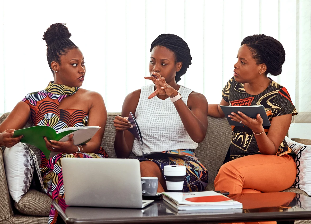 Ad-frican members in deep conversation, sharing ideas and building connections